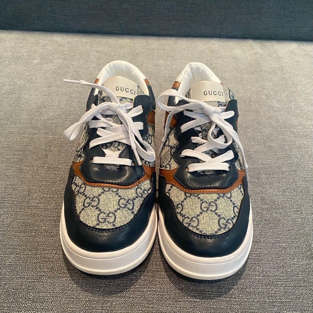 Cute Navy blue, brown, and white sneaker shoes.